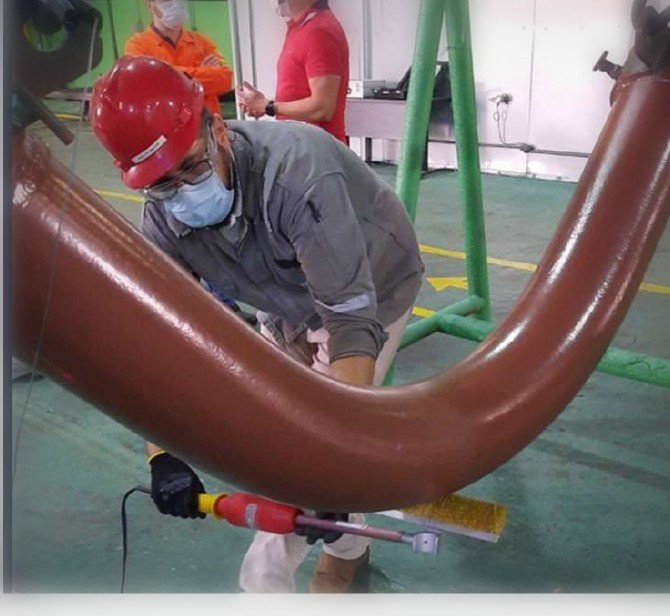 Aplicação de FBE em campo sobre spool curvo
